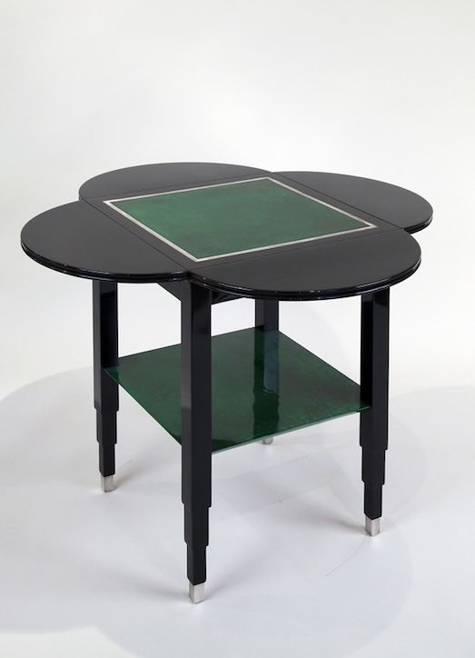 Drop-leaf table by Marcel Coard, c. 1930. Black-lacquered wood and green tinted parchment, silver bronze feet.​