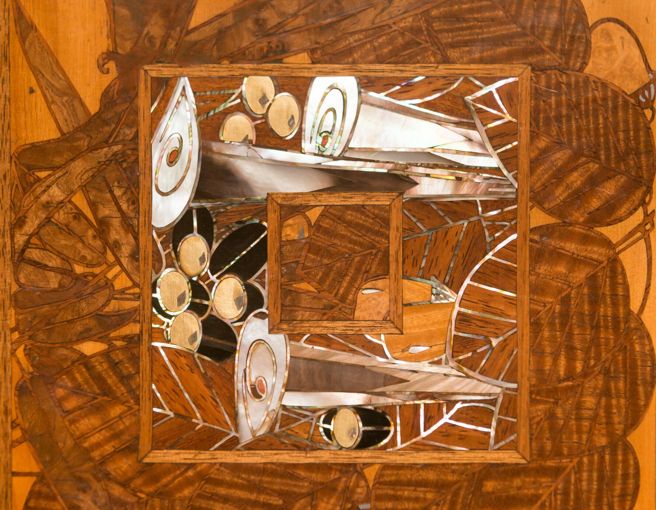 Three tables in East Indies Satinwood by Georges De Feure, c.1910. Table tops marquetry with a floral inlay, mother of pearls, ebony and fruit wood.