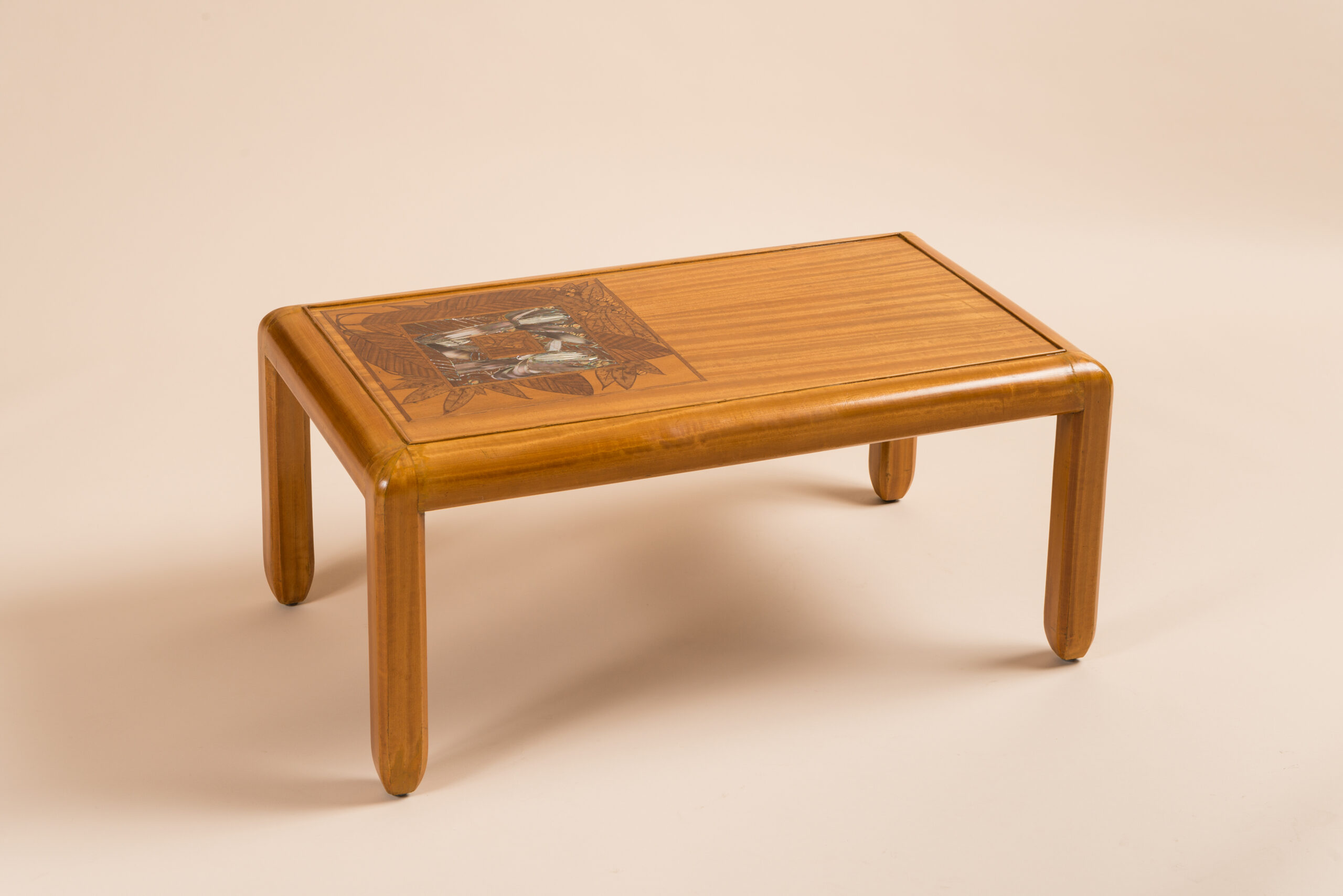 Three tables in East Indies Satinwood by Georges De Feure, c.1910. Table tops marquetry with a floral inlay, mother of pearls, ebony and fruit wood.