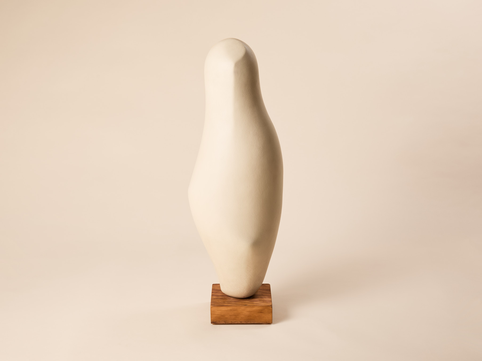 Sculpture​ by Michell Hartmann, c. 1975, white Abstract sculpture.​ Off-white ceramic on wooden base.