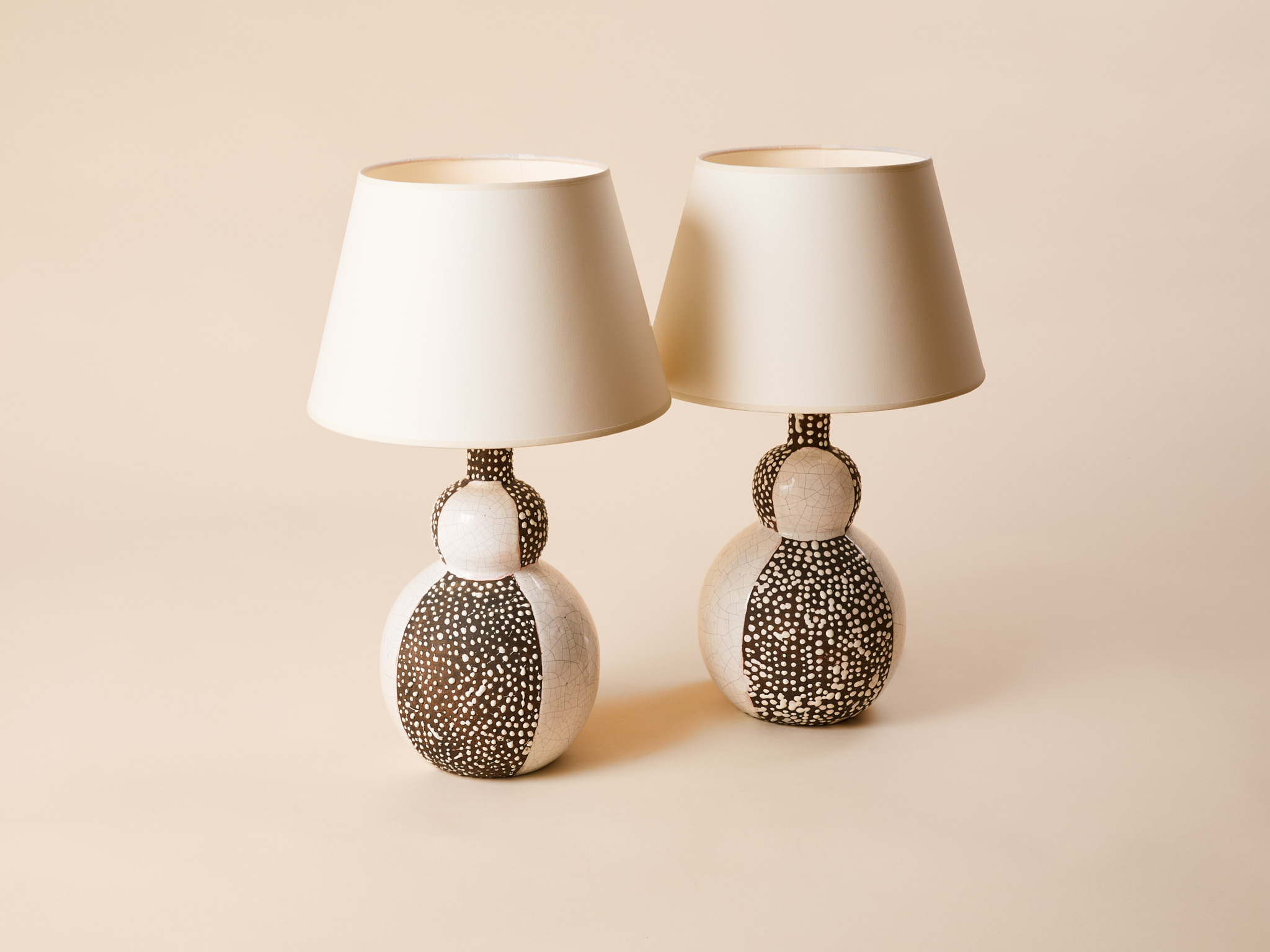 Pair of lamps by Primavera,c.1926. Crackled white enamel and mat black engobe earthenware.