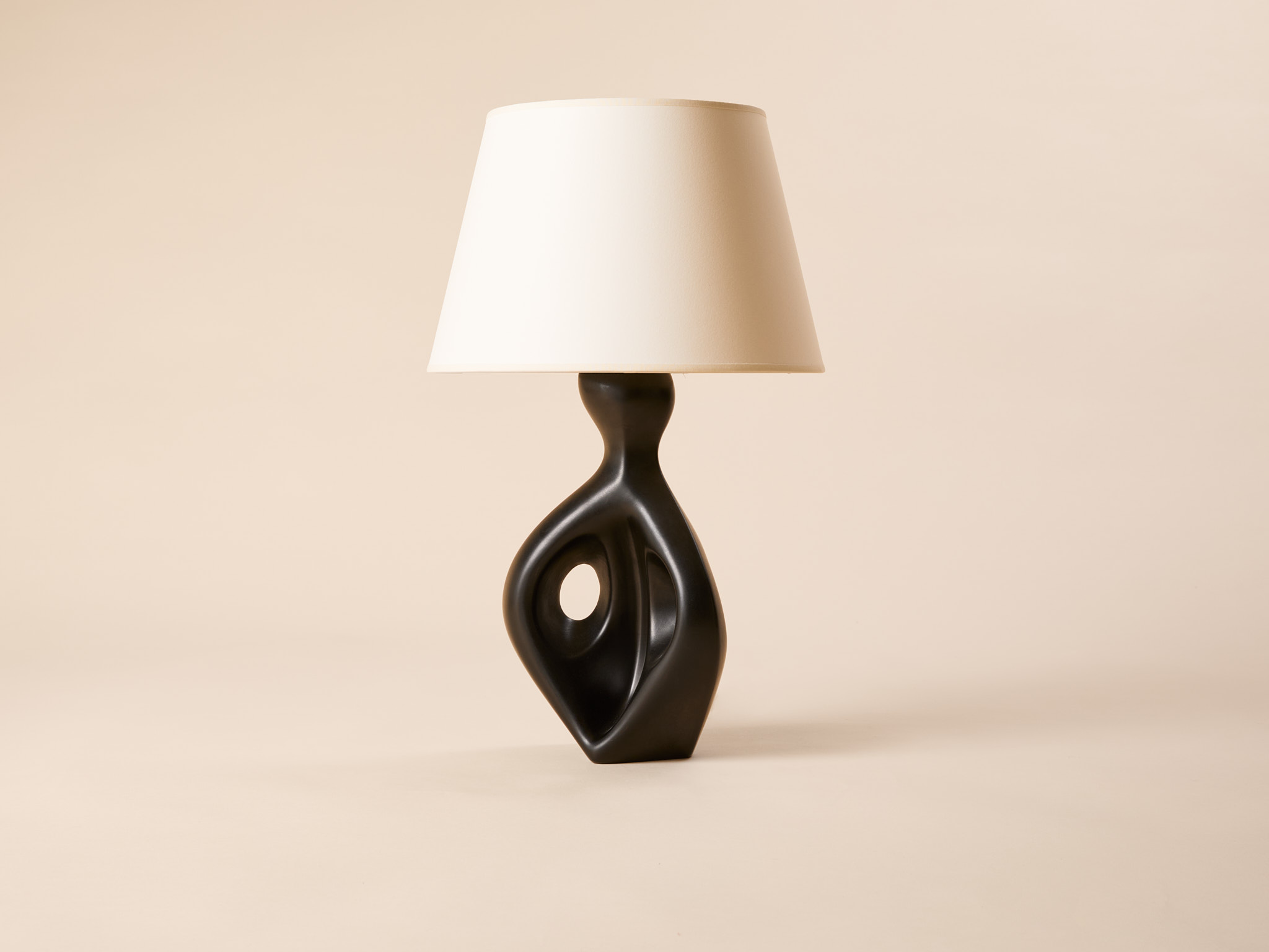 Freeform lamp in molded black glazed ceramic, c. 1950.