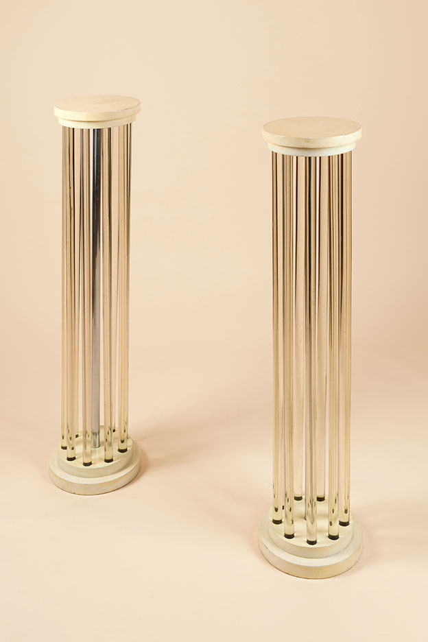 Pair of columns​ by Syrie Maugham, c.1923. Tubular glass, chromed metal tube and painted wood​.