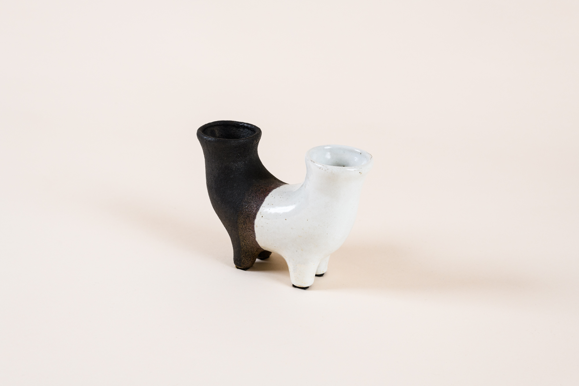 Double-necked vase by ​Gilbert Valentin, c.1950, black and white enamelled ceramic.​