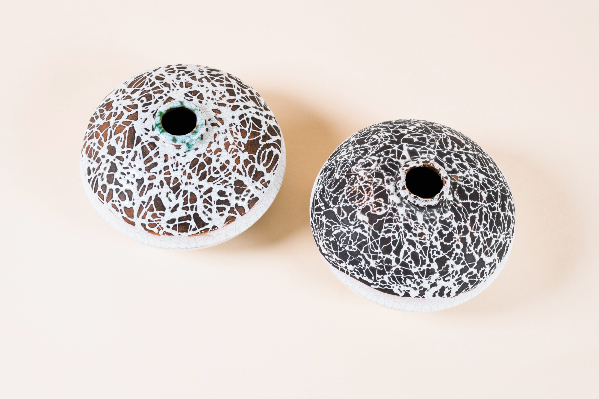 Pair of vases by Primavera, c.1930. ​White crackled glazing and splattered enamel.