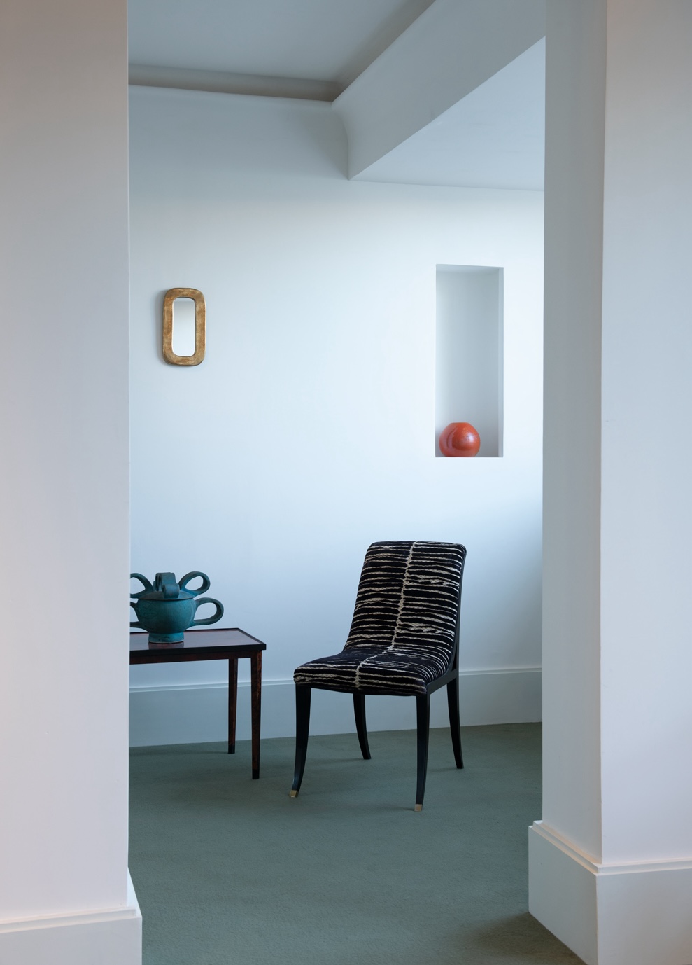 Covered pot by Gio Colucci, 1939, black lacquered wood chair c.1925 and Orange enamelled ceramic vase by Primavera, CAB, c. 1930.