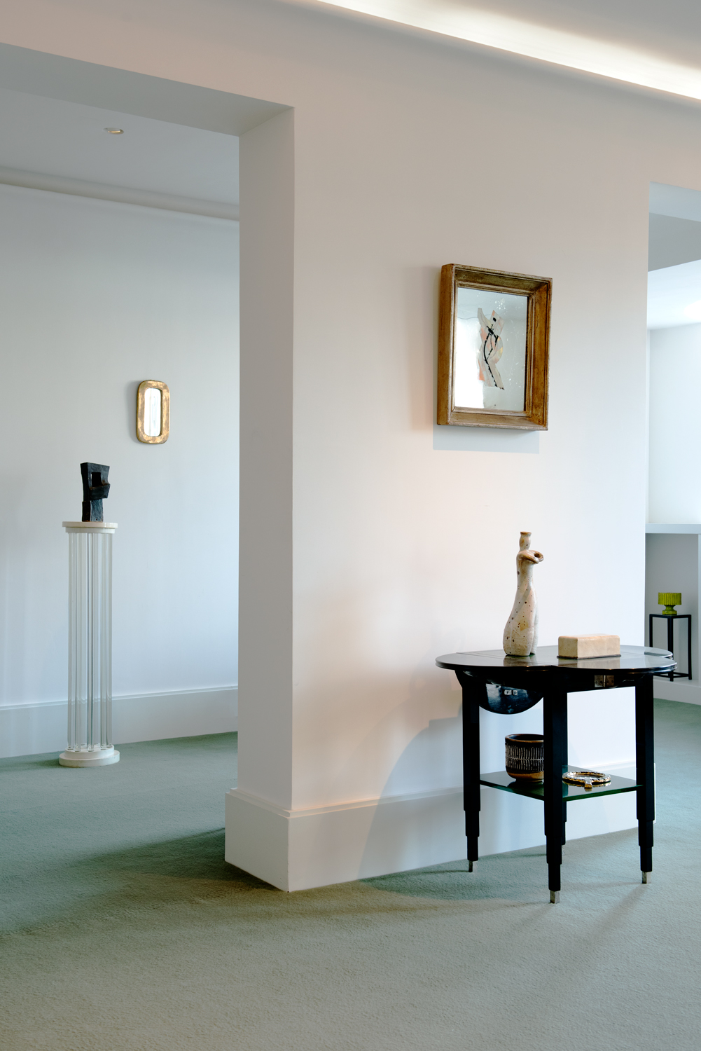 Drop-leaf table by Marcel Coard, c. 1930, column by Syrie Maugham, c.1923, sculptures by Vassil Ivanoff c. 1960 and reverse painting mirror by Etienne Cournault, c. 1925.