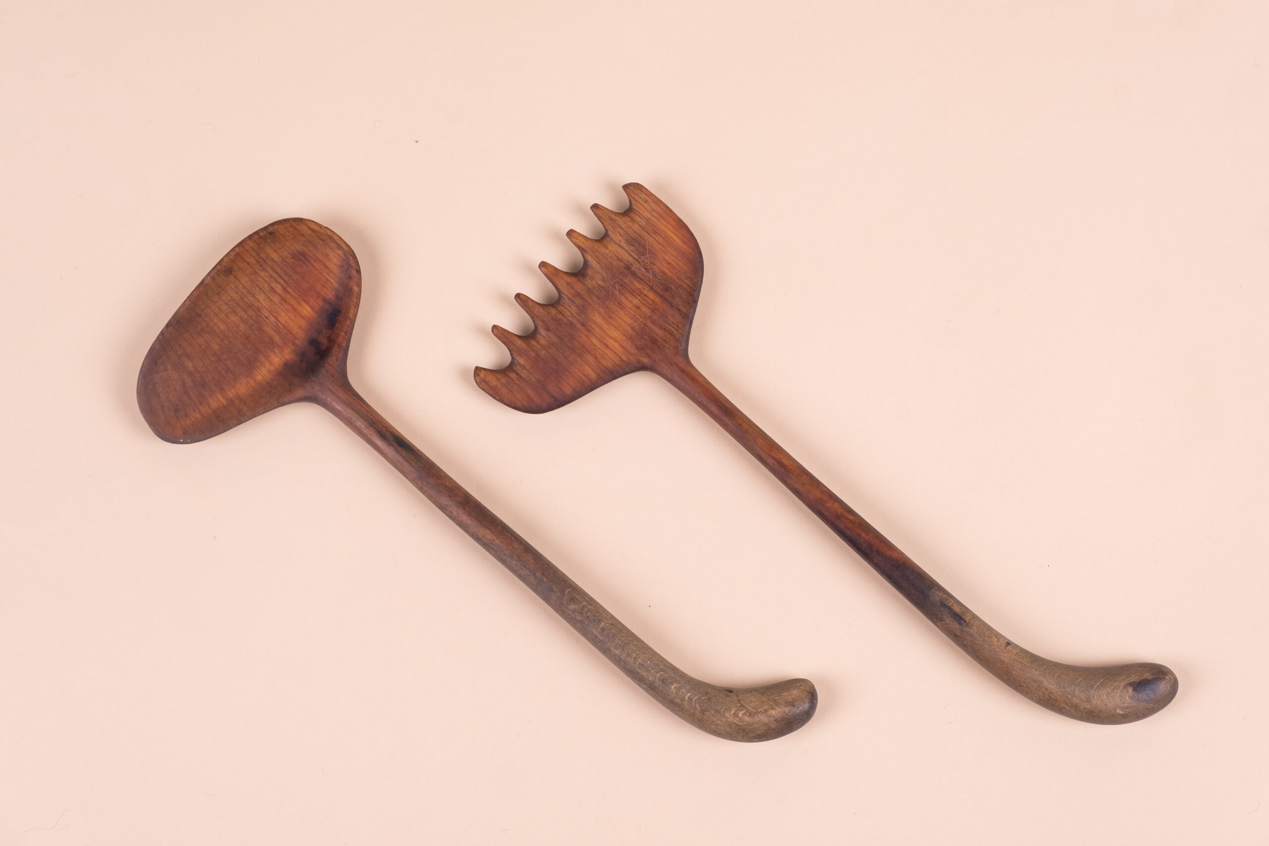 Stylized wooden set of servers carved in direct cut by Valentine Schlegel c. 1960.