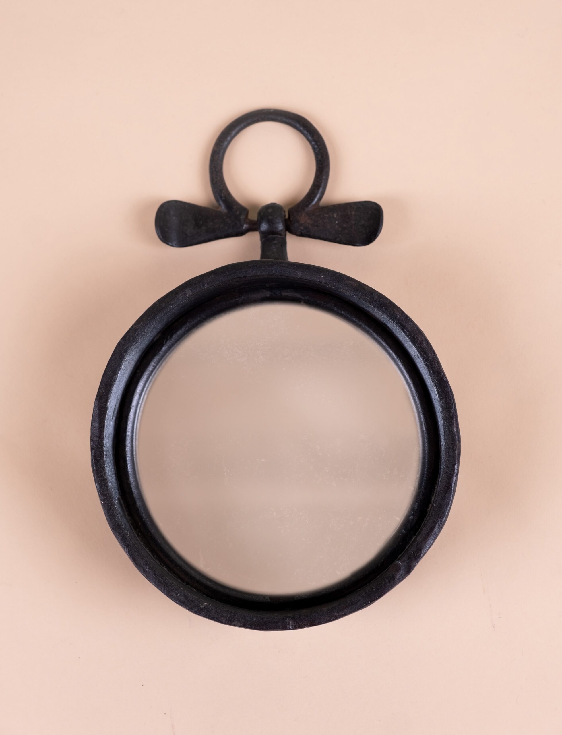 Small patinated iron wall mirror​ c.1965.