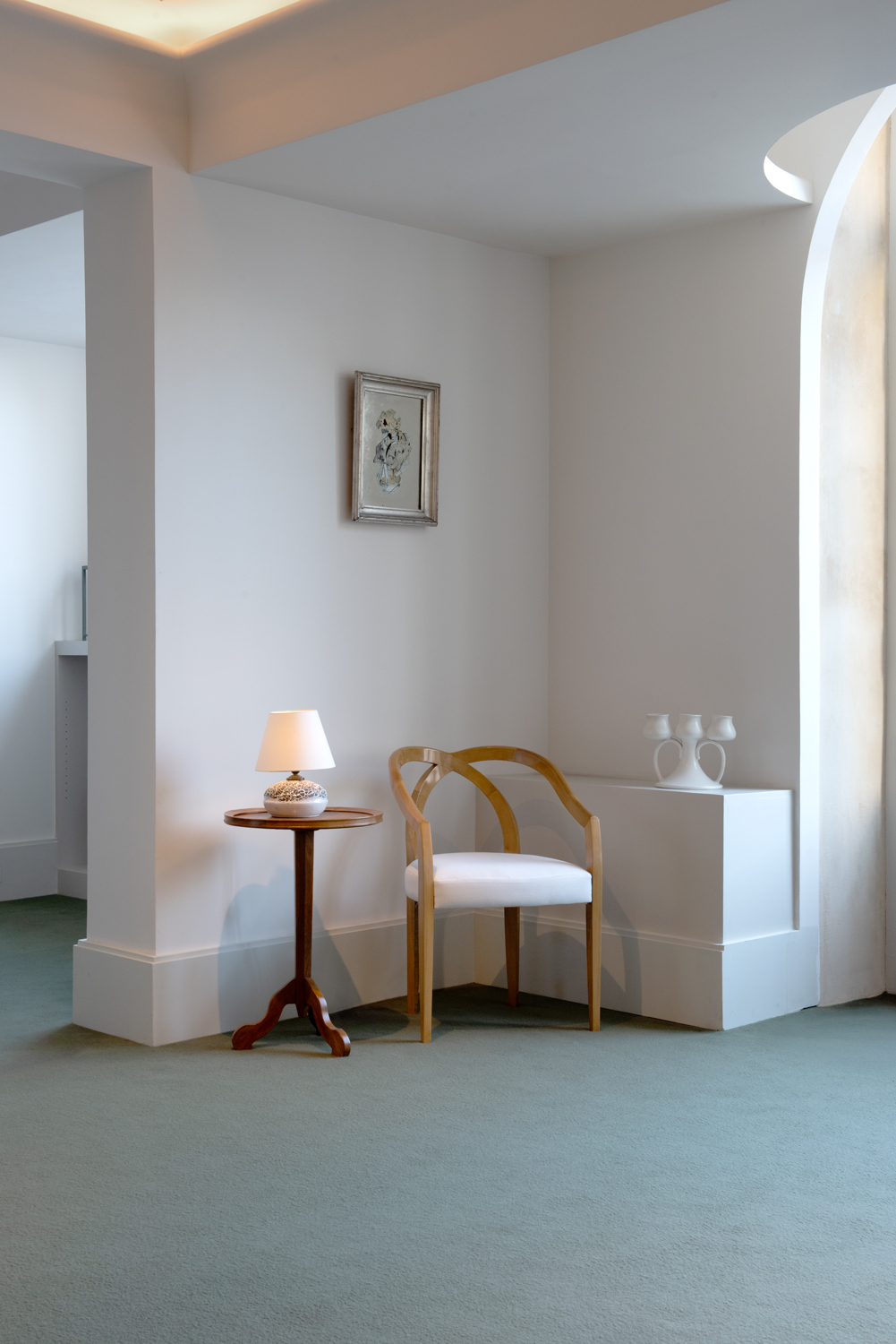 Side table by Jean-Michel Frank c.1920​, « Architecture »​ reverse painting mirror ​by Etienne Cournault, c. 1925 and Sycamore "Crossed Legs" armchair by Sylvain Dubuisson & Sandra Carigliano, 2023