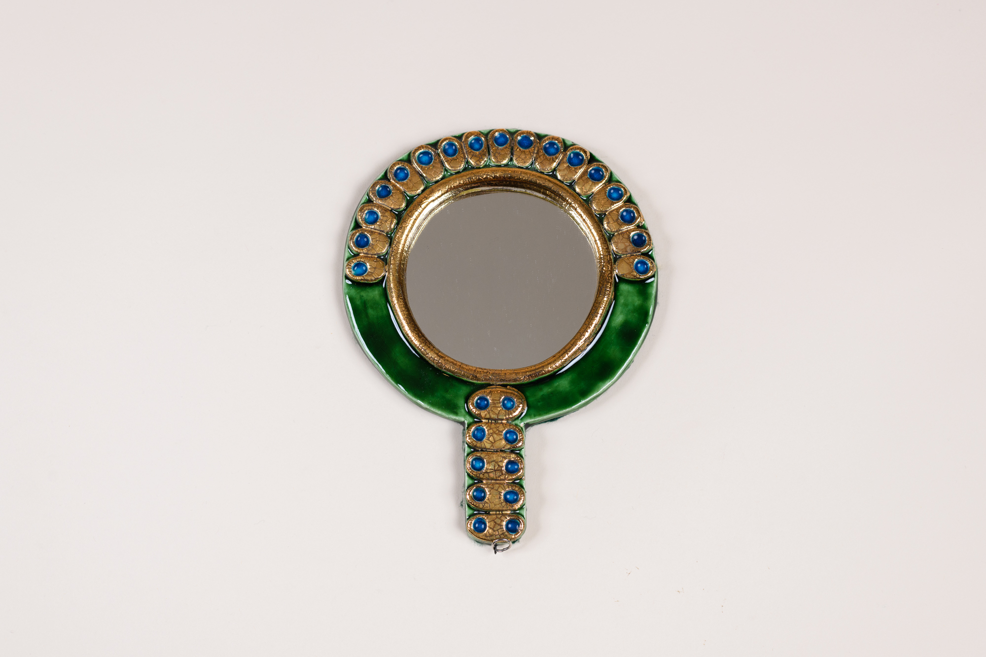 « Scales », ceramic hand mirror ​by Mithé Espelt, c.1976, cracked gold and enamelled terracotta ​.