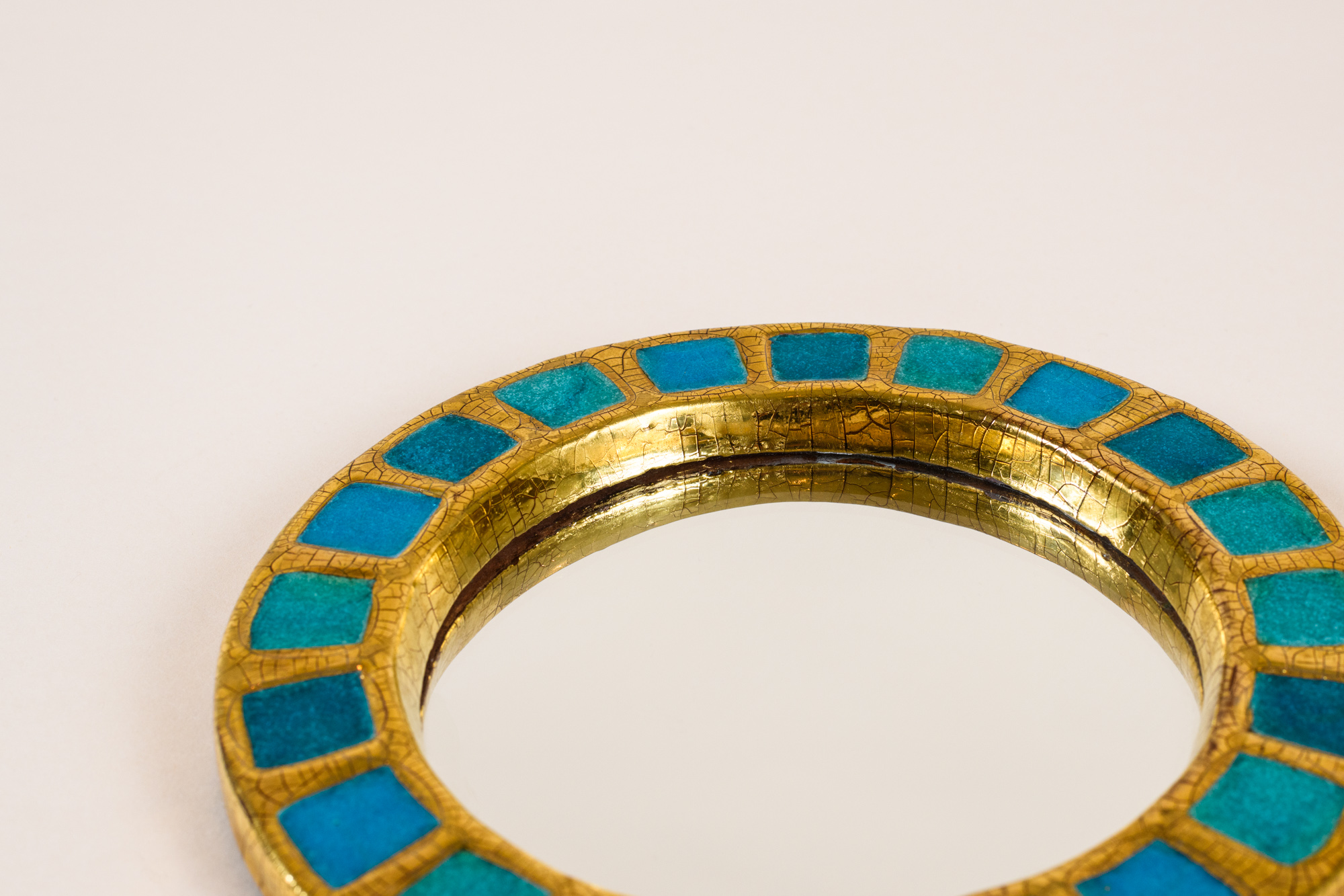 “Engrenage” round mirror​ by Mithé Espelt​, c.1950, crystallized blue glass and crackled gold​​.